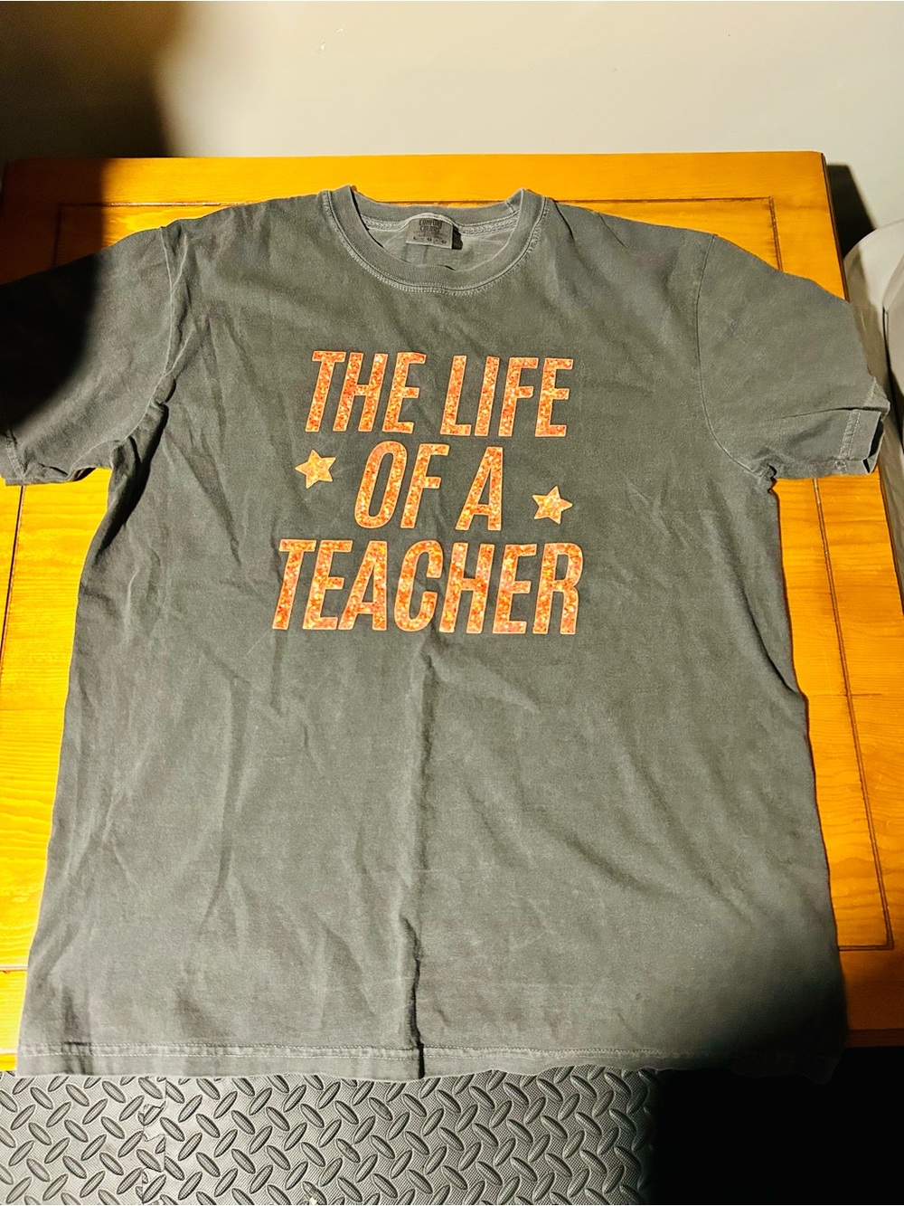 Taylor Swift Black Tee with Orange Text Graphic ‘The Life of a Teacher’